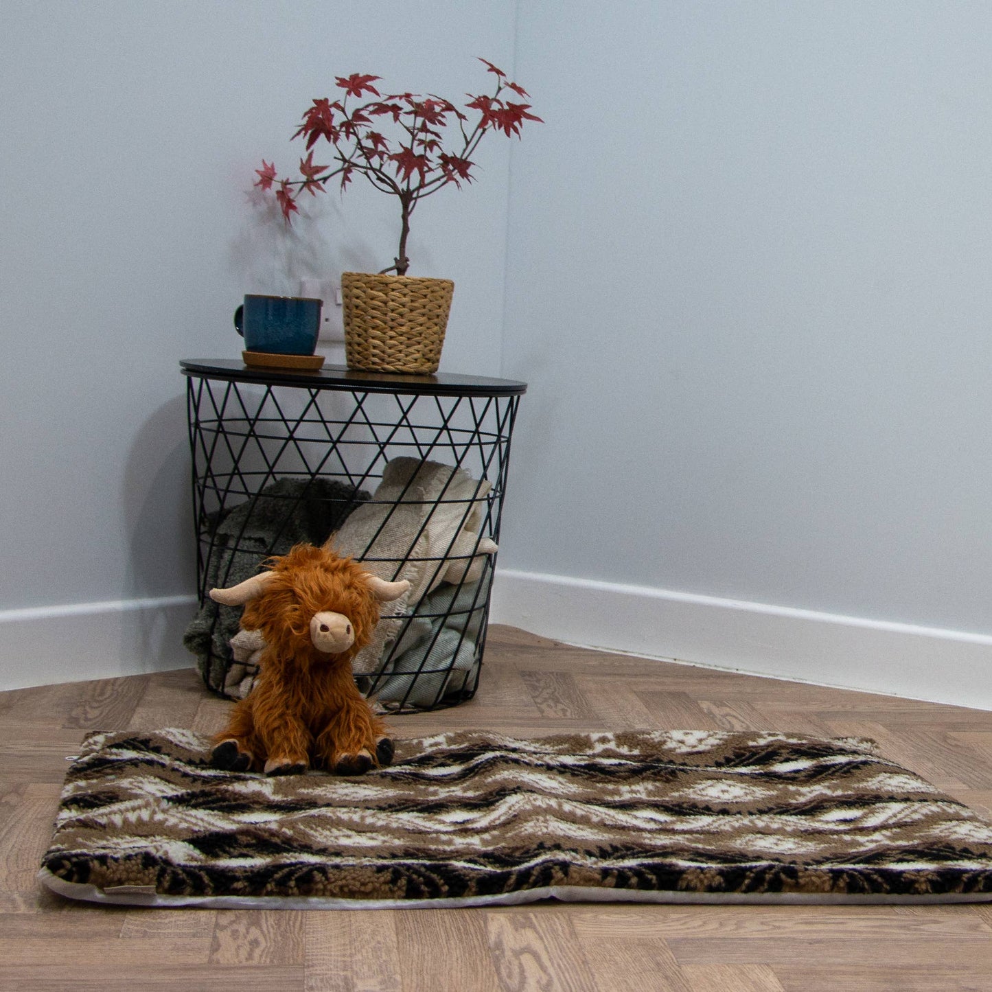 Large plush dog toy with a built-in squeaker for interactive fun. Designed for dogs who love to cuddle and play with soft yet engaging toys.