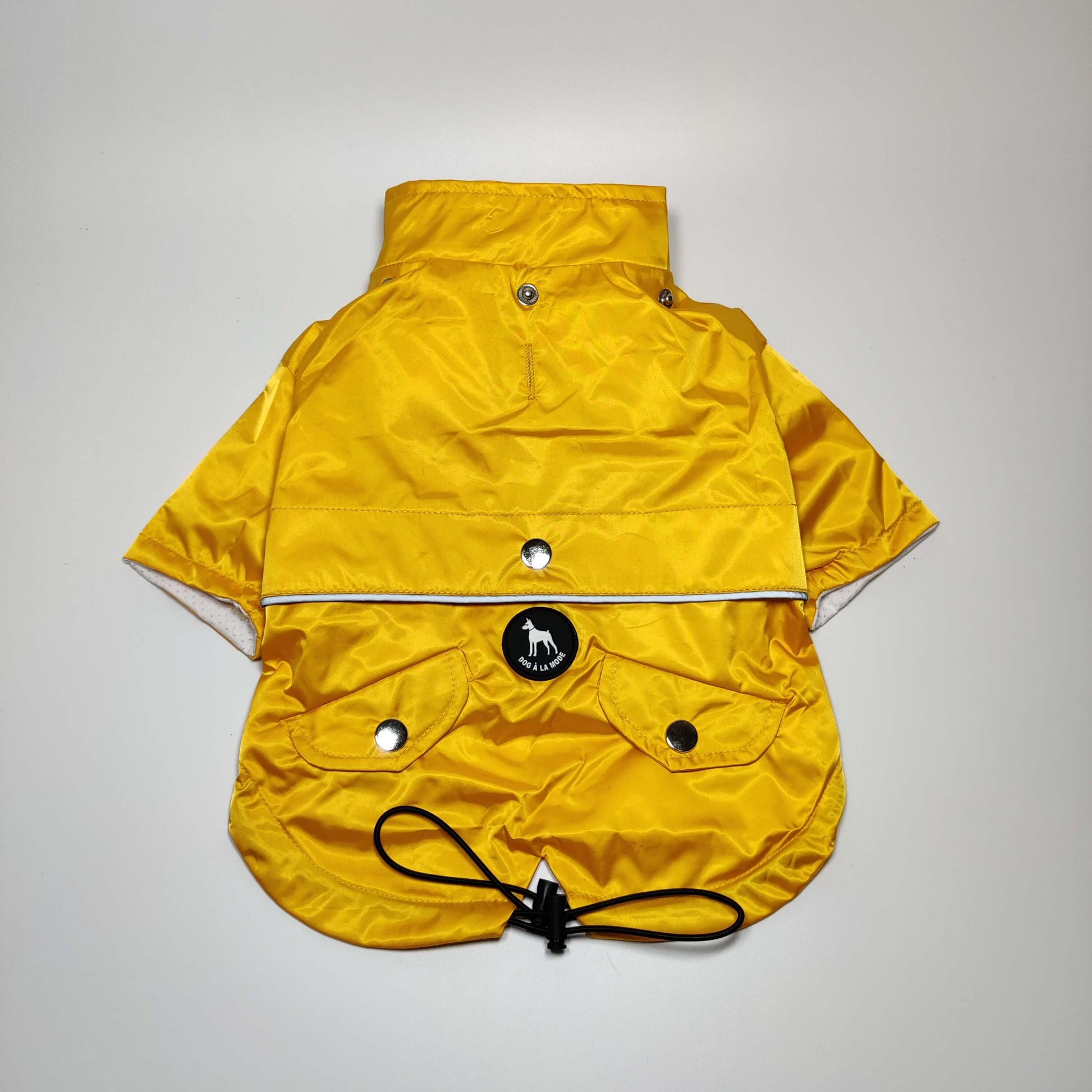 View of a dog running in the Yellow 'Buddy' Dog Raincoat showcasing mobility and comfort.