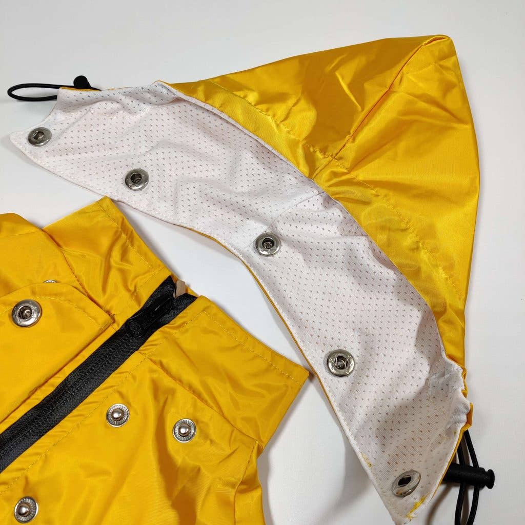 Top view of the Yellow 'Buddy' Dog Raincoat displaying its smooth fabric and detailed stitching.
